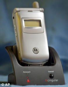 A Cingular "Fast Forward" cradle and Motorola mobile phone model 9255 is photographed in New York Tuesday Nov. 4, 2003. The cradle, a component of the new FastForward service from Cing