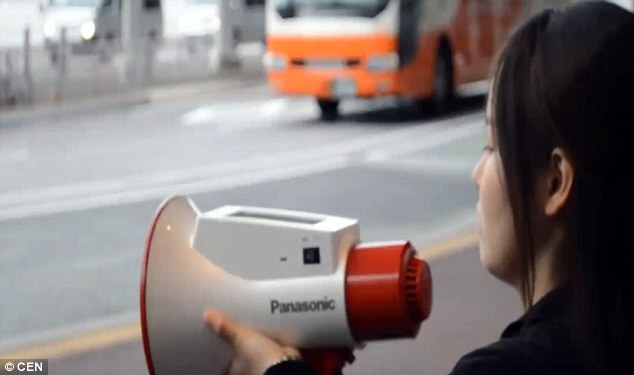 Users of the Megaphoneyaku can select which language they want the megaphone to translate their words into using a touchscreen on top of the device (pictured). For general information announcements they can also ask the device to translate what they say into all three languages