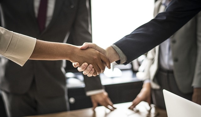 Handshake Illustrates Success Domain Buy with Domain Broker